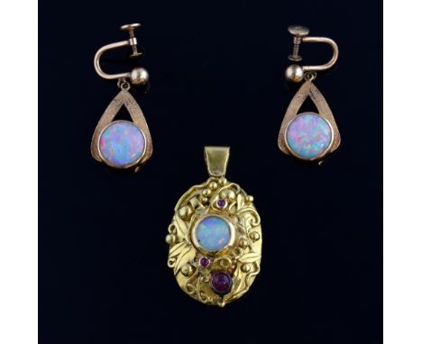 Opal and garnet set pendant, tested as 18 ct with leaf and scroll decoration, unmarked yellow metal, 4 cm, and a pair of opal