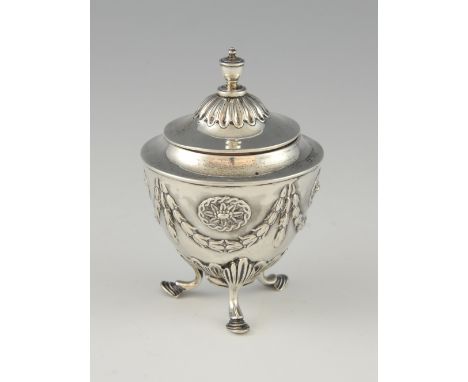 An Edward VII silver urn form tea-caddy, decorated with swags and on three hoof feet, by Martin Hall and Co., Sheffield 1904,