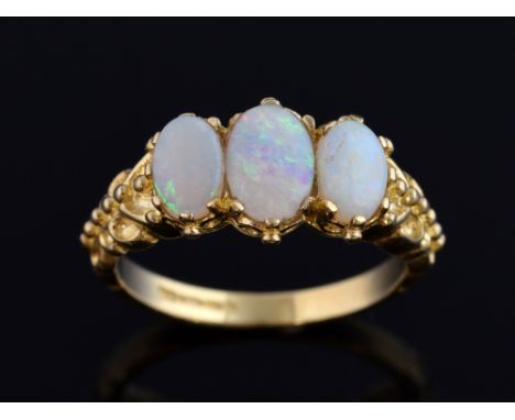 Three stone opal ring with petal shoulders, in 9 ct yellow gold, ring size L 1/2 .   Gross weight 3 grams