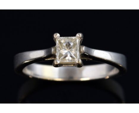 Single stone diamond ring, set with emerald cut diamond of 0.30 carats in 18 ct white gold mount.  Ring size K 1/2 .   gross 