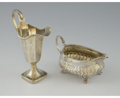 A Victorian silver sauce boat, with lobed lower body and floral chased upper body, by Army & Navy Cooperative Society Ltd., L