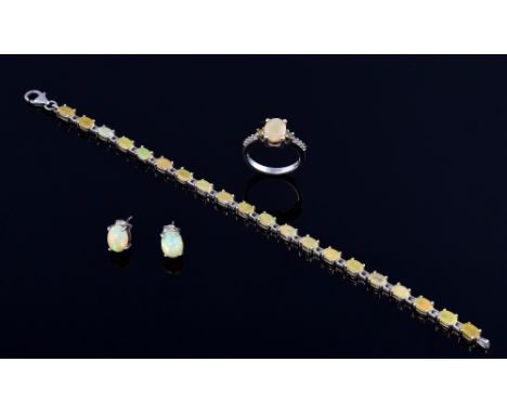 Modern yellow opal bracelet earring and ring set in silver  .   