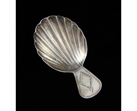 A George III silver caddy spoon with scalloped bowl, 6.5 cm long, 8 gr. .   