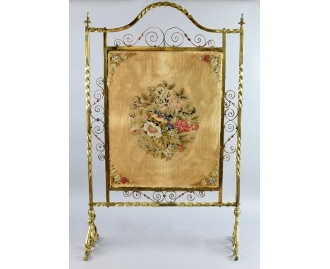 19th century brass and copper  fire screen  inset with German  wool work panel  96cm x 57cm .   