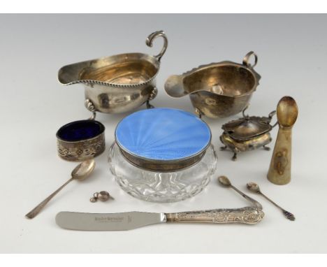 A selection of silver to include a silver and enamel mounted dressing table jar, two sauce boats, three spoons, a mustard pot