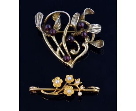 Edwardian gold and seed pearl brooch, and a later silver gilt mistletoe brooch .   