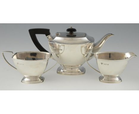 George VI silver three piece tea service, comprising teapot, cream jug and sugar bowl, by Harrods Ltd., Birmingham, 1936, gro