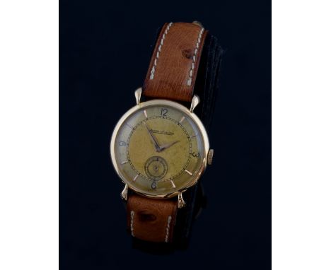 Jaeger LeCoultre 18ct rose gold watch, gold coloured dial with applied faceted gilt arrow hour markers and black Arabic numer