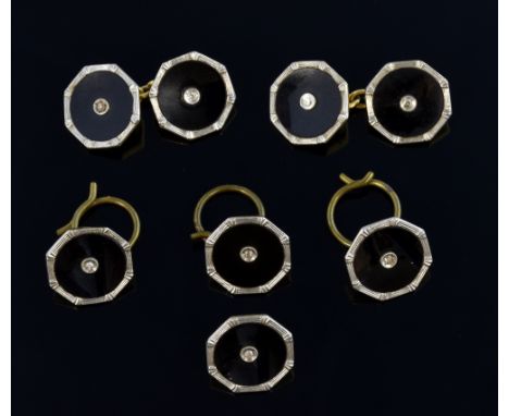 An Art deco onyx and diamond dress set comprising a pair of cufflinks, four buttons. Each piece has a platinum border and a c