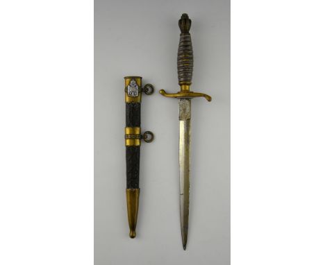 Russian dagger with metal scabbard and brass mounts, the blade 23 cms.  .  