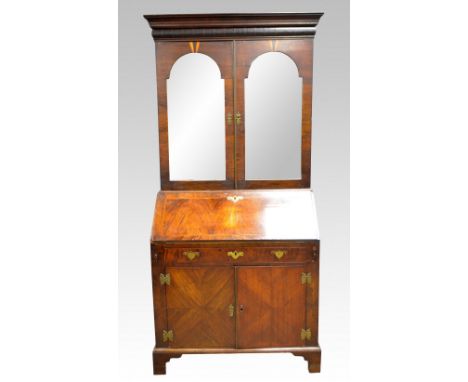 19th century walnut and herringbone cross-banded bureau cabinet with mirrored doors over fall flap enclosing central cupboard