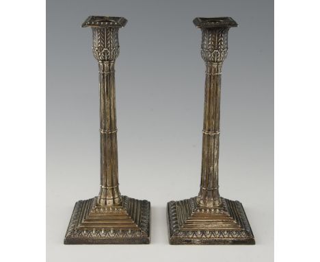 Pair of Victorian silver candlesticks with reeded columns on square stepped base, by William Hutton & Sons Ltd., London, 1893