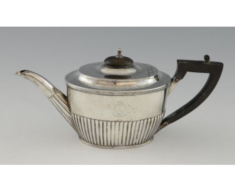 A Victorian silver teapot, with half-gadrooned body and presentation inscription for 1890, marks rubbed, gross weight 9.4 oz,