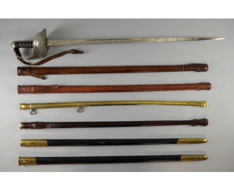 A collection of five assorted scabbards, two sword knots, modern Officer's sash, bugle tassel (9)Provenance:- From the estate