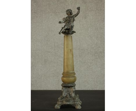 An early 20th century carved alabaster and spelter table thermometer in the form of a classical column with cherub sitting on