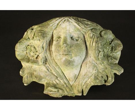 A concrete wall planter in the form of a an Art Nouveau female head with flowers in her hair.  H.20 W.35 D.18cm. 