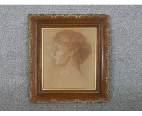 A framed and glazed pastel portrait of a female, unsigned. H.49 W.45cm 