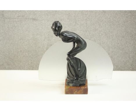 An Art Deco spelter bather figural lamp on marble base with frosted disc shade. (Glass disc damaged.) H.26 W.28 D.12cm. 