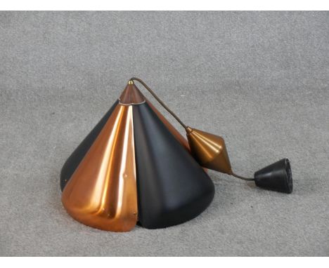 A mid-century copper and black enamel stylised floral design ceiling light with white painted interior. H.35 W.37cm 
