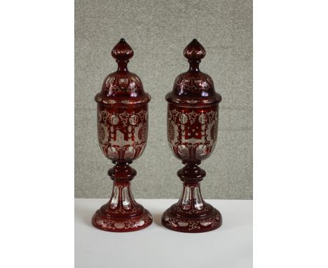 A pair of large 20th century Bohemian ruby flash goblets and covers, with engraved castle and bird decoration. H.43 Dia.14cm.