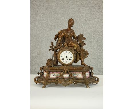 A 19th century French gilt spelter figural design mantle clock with hand painted porcelain panels and white enamel dial. H.40