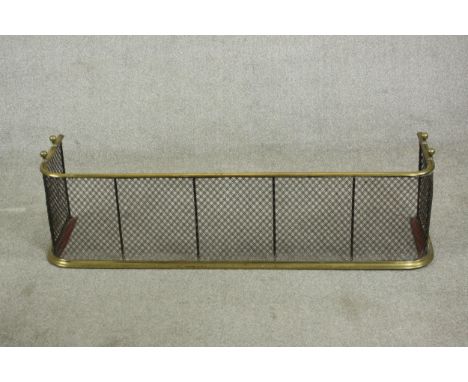 A Victorian brass fireguard or fender with a mesh grille. H.31 W.118 D.31cm. 