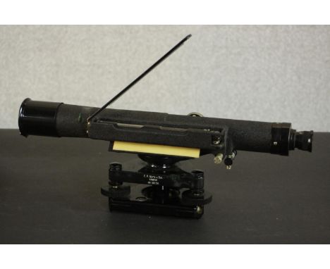 A mahogany cased early 20th century E R. Watts surveyors levelling scope, retailed at Brunnings of Holborn. H.16 W.43 D.18.5c