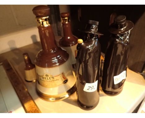 Two Sandimant port ceramic bottles and five Bells whisky ceramic bells