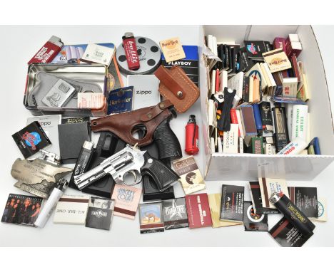 ASSORTED LIGHTERS AND MATCHSTICKS, to include a P38 Western lighter with stand, a 44 Magnum lighter with stand, five boxed/ti
