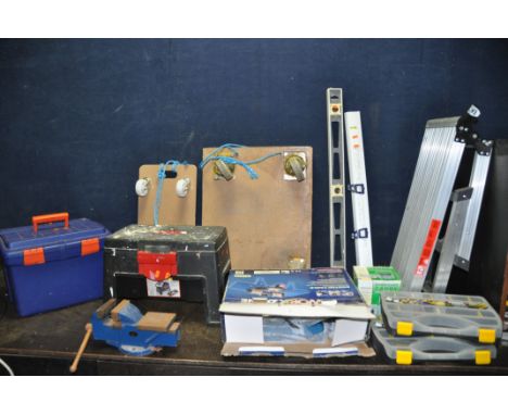 A COLLECTION OF HAND TOOLS including two wheeled trolleys, a platform step, two toolboxes, two tool trays, a Mount Tai engine