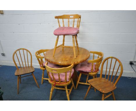 A MINE CIRCULAR TABLE, diameter 97cm x height 76cm, along with a set of four beech captain's chairs and two Ercol chairs (con