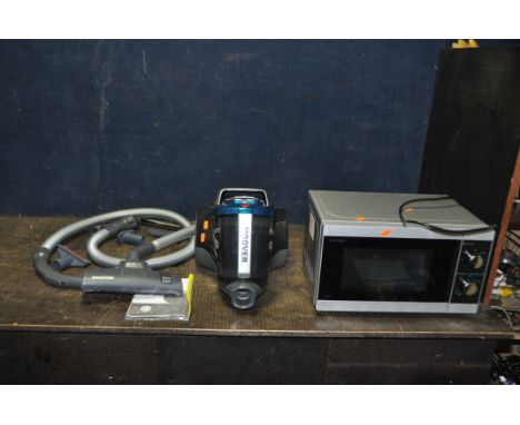 A HOOVER BREEZE VACUUM CLEANER with manual and some accessories along with a Sharp microwave (both PAT pass and working)