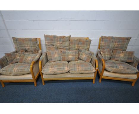 A THREE PIECE LOUNGE SUITE, with beech frames, comprising a two seater sofa and a pair of armchairs (condition report: in nee