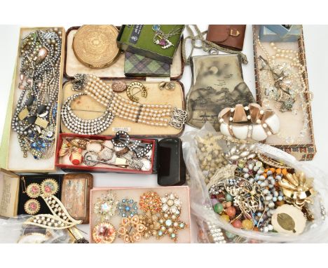 A SELECTION OF COSTUME JEWELLERY, to include an early 20th&nbsp;century rolled gold locket with floral detail, a large paste 