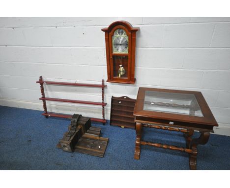 A 20TH CENTURY FLAMBOYANT MAHOGANY OCCASIONAL TABLE, with a bevelled glass insert, raised on scrolled supports and shaped leg