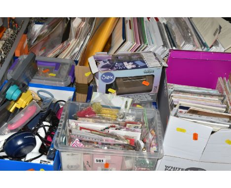 SEVEN BOXES AND LOOSE PAPERCRAFTING SUPPLIES, to include 12'' x 12'', A4, A5 and smaller papers, cardstock, a boxed Sizzix Ti