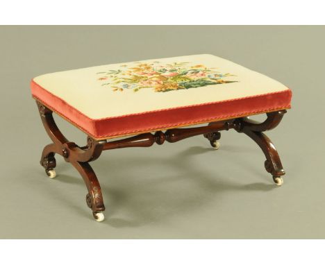 A large Victorian mahogany dressing stool, the rectangular top upholstered in foliate patterned woolwork and velvet and raise