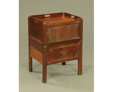 An early 19th century mahogany commode cabinet, with tambour front and raised on moulded legs of square section.  Height 75 c