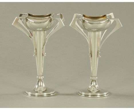 A pair of Art Nouveau silver vases by J & R Griffin Chester, 1915, weighted.  Height 17.5 cm (see illustration). CONDITION RE