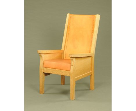 A Mouseman Thompson of Kilburn armchair, with leather upholstered back and seat and with typical mouse trademark.  Width acro