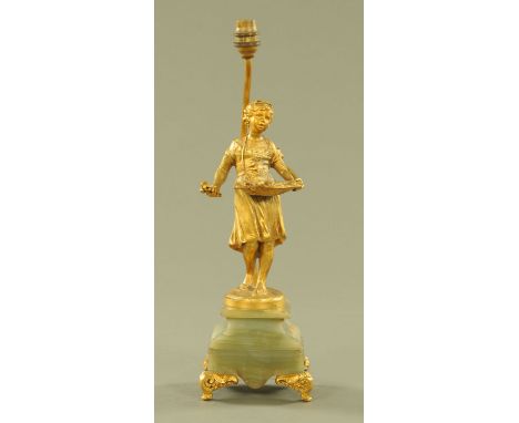 A late 19th century French spelter figural table lamp, flower seller, raised on onyx base with four scroll feet.  Height 46 c