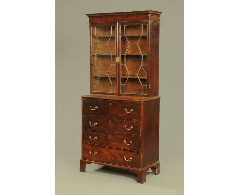 A George III mahogany secretaire bookcase, with dentil cornice above a pair of glazed doors, the base with a secretaire drawe