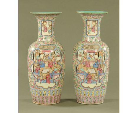 A large pair of 19th century Cantonese vases, decorated with panels of figures in typical Canton colours.  Height 62 cm, diam