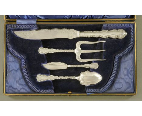 A Victorian silver plated condiment set, bread, bun and butter, in plush lined case.  