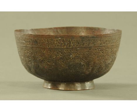 An antique Persian bronze bowl, diameter 20 cm.