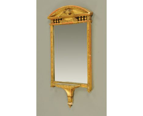 A late 19th/early 20th century Adam style gilt framed mirror, with urn and bellflower motif to the arch, with rectangular mir