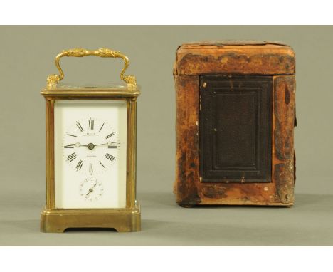 An Edwardian brass carriage clock by Mahr of London, with alarm, single train and with carrying case.  Height excluding handl