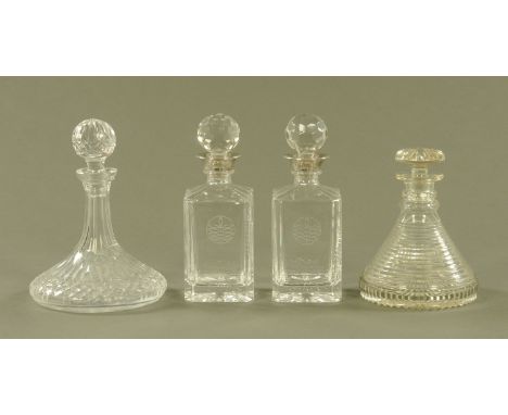 A cut glass ships decanter, another similar and a pair of square form decanters.