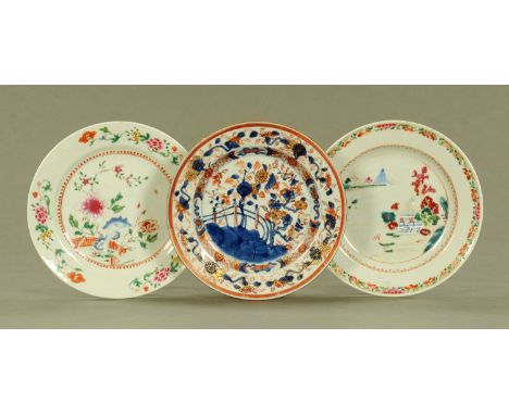 Three late 18th/early 19th century Chinese plates, one Imari and two decorated with chrysanthemum, fence and buildings.  Each