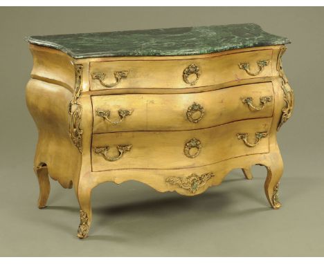 A French style gilt painted serpentine fronted commode chest of drawers, with green marble top.  Height 84 cm.